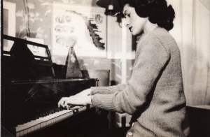 Album 03-018a Veneta at her beloved piano, 1946